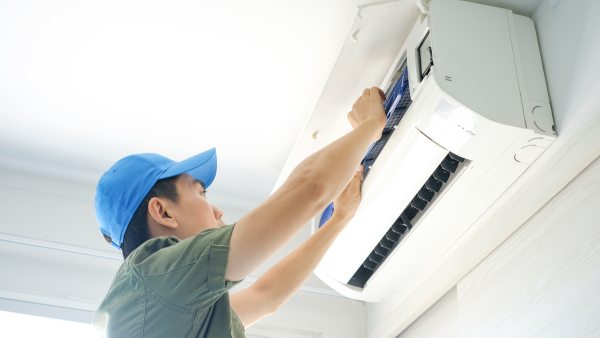 This is an image of GT HVAC & Electrical installing a reverse cycle air conditioner in a home